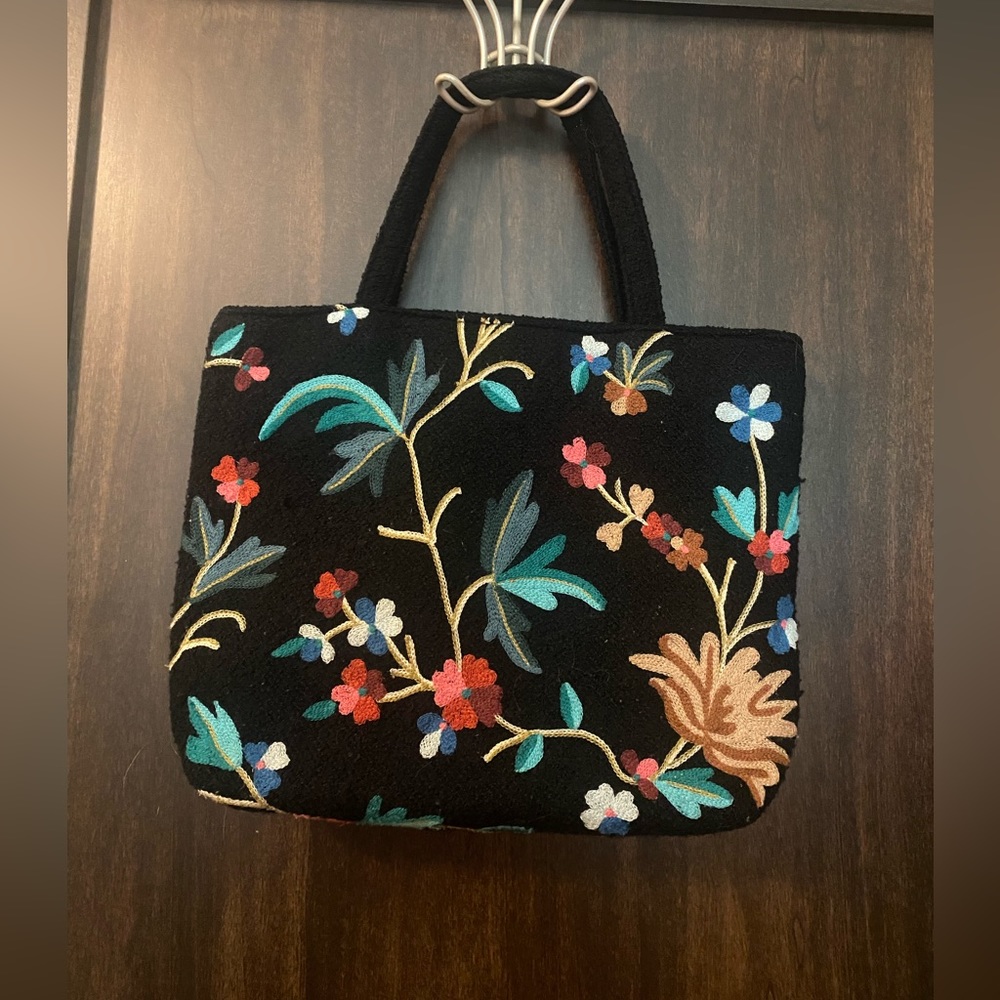Embroidered knit handbag.